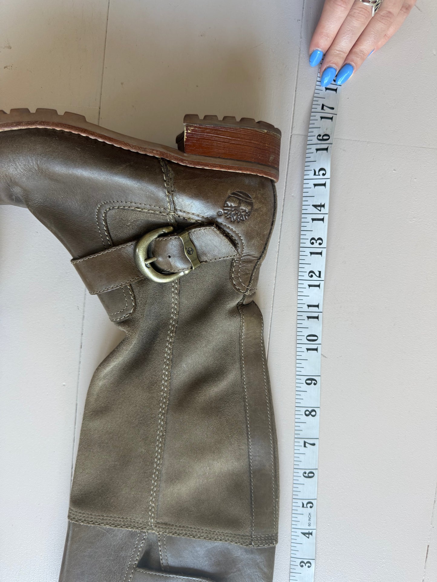 Timberlands brown chunky boots with brass buckle detail